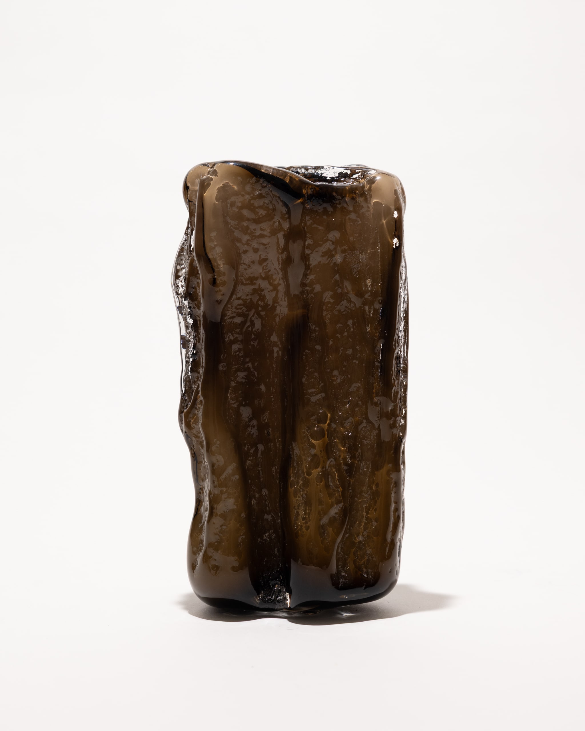 A dark smoked cast, out of the mould, unlit