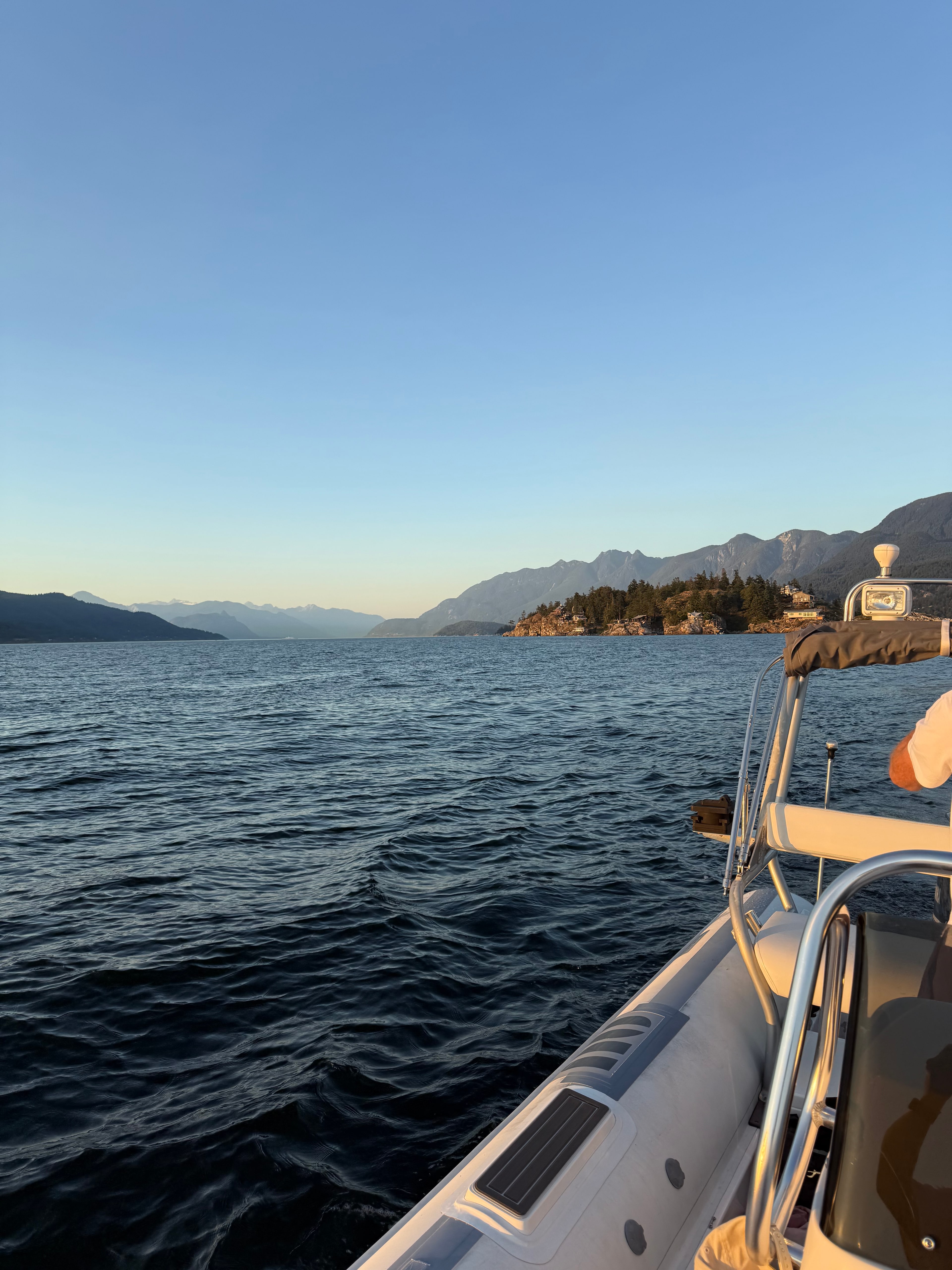 Crossing the water at golden hour, the North Shore behind