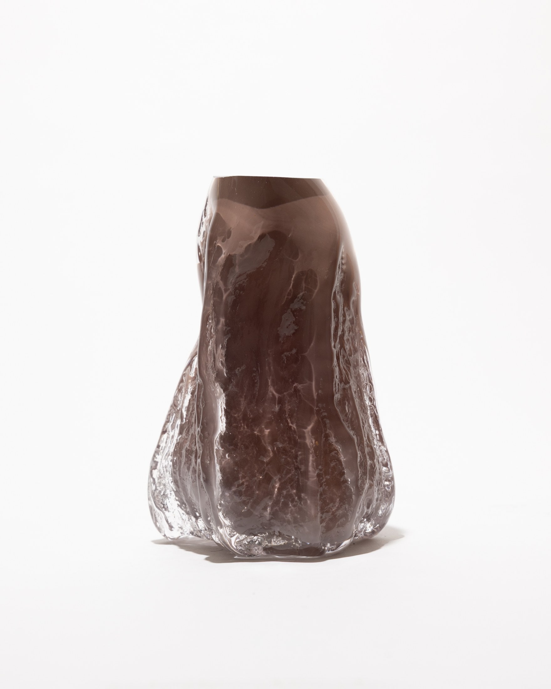 The vase empty — smoke glass over a clear foot, on white
