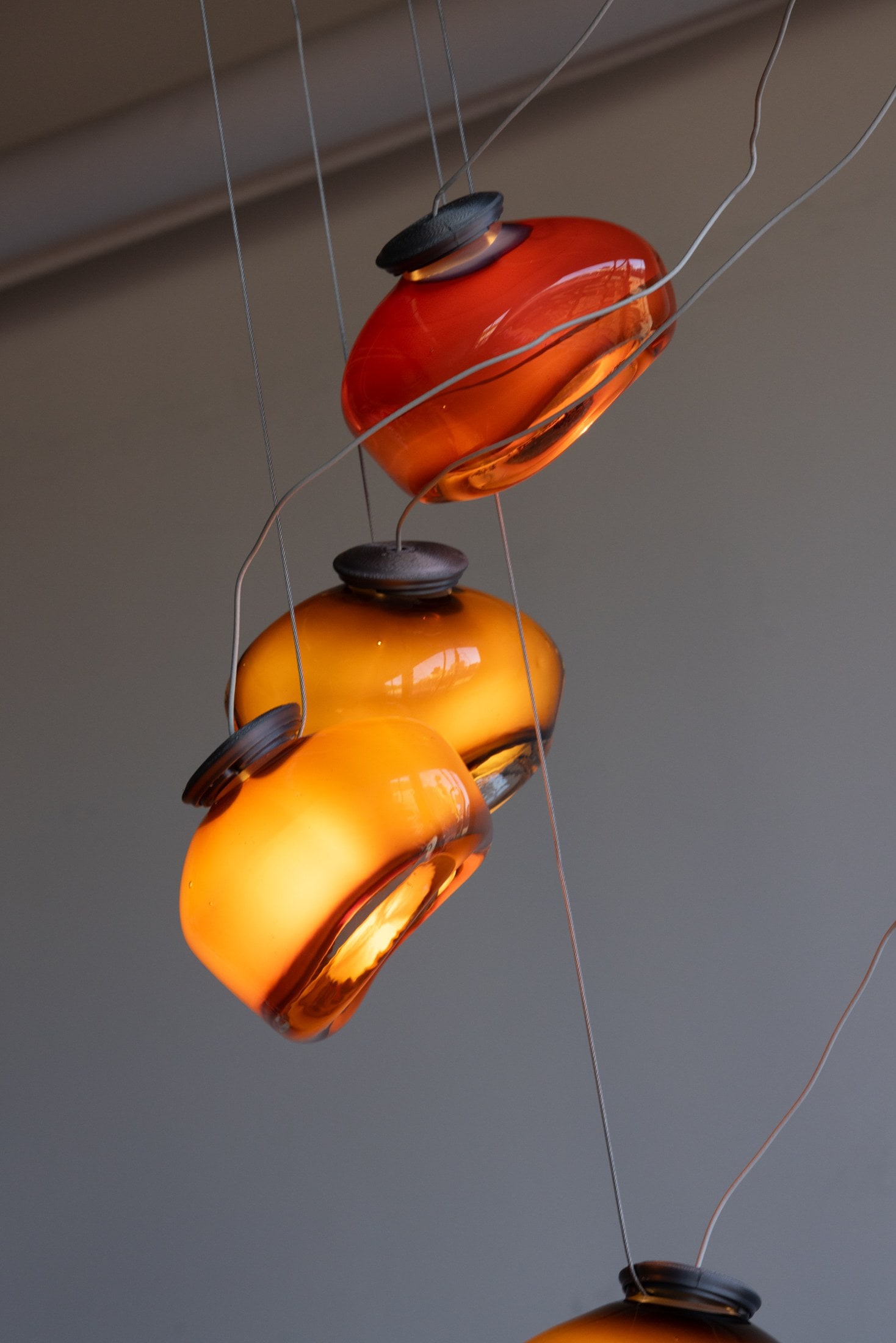 Three pendants on cord, from below