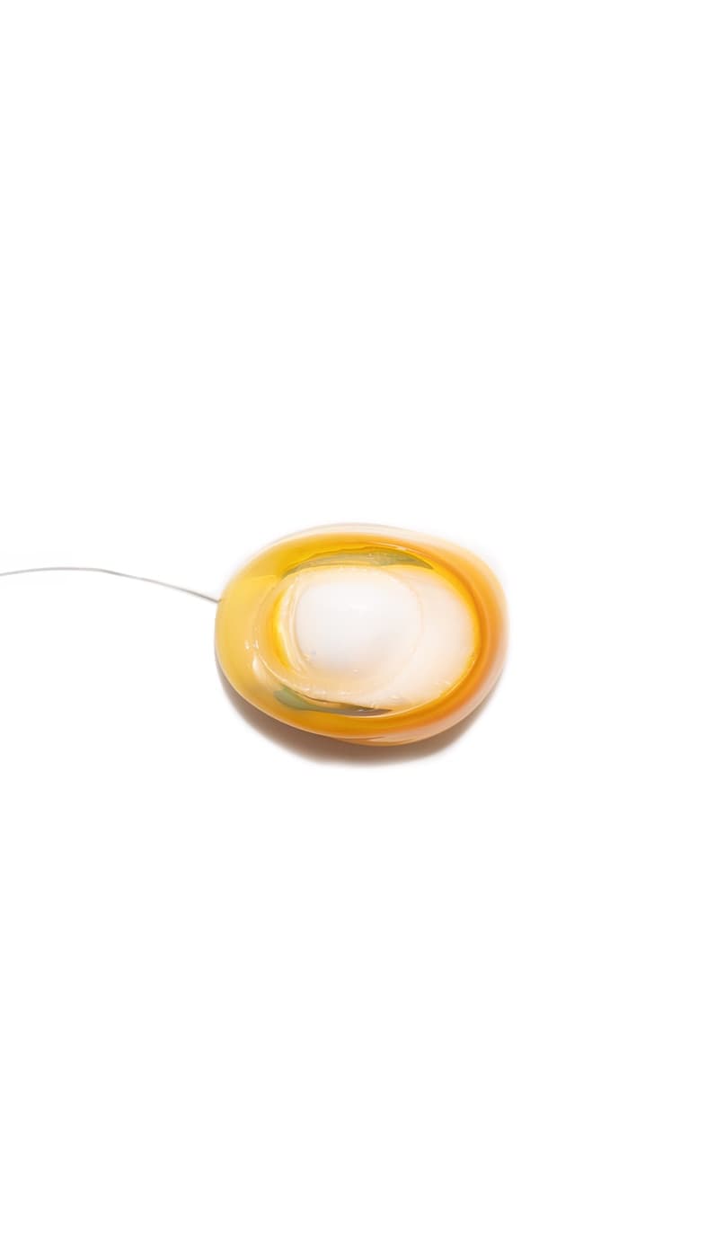 Yolk yellow pour over a white core, lit